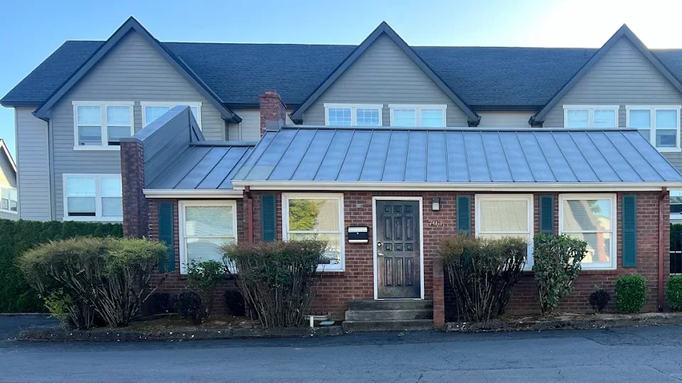 Resolution Health's brick office with green shutters in Gresham